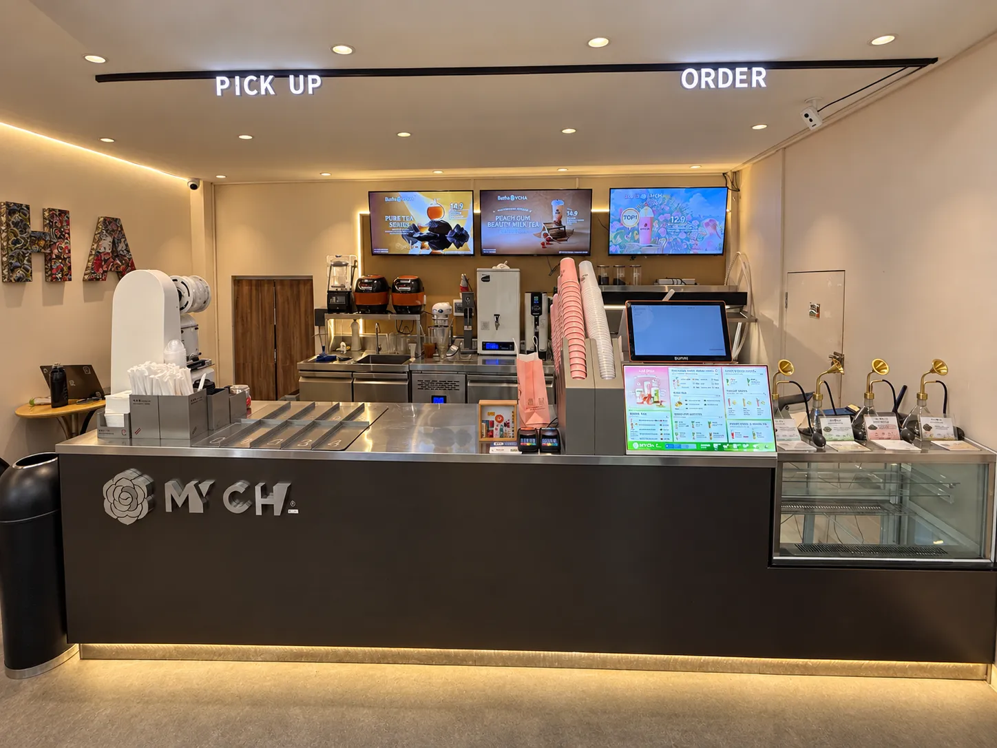 MYCHA service counter with drink menus and tea dispensers