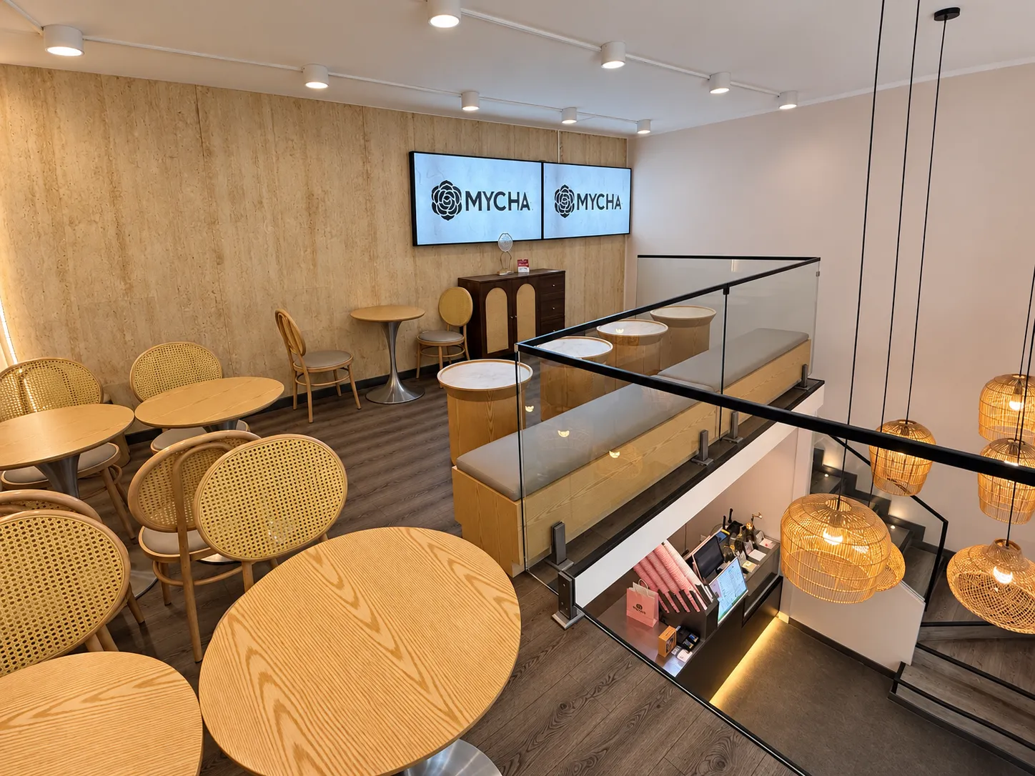 MYCHA mezzanine seating overlooking the service counter and woven pendant lights