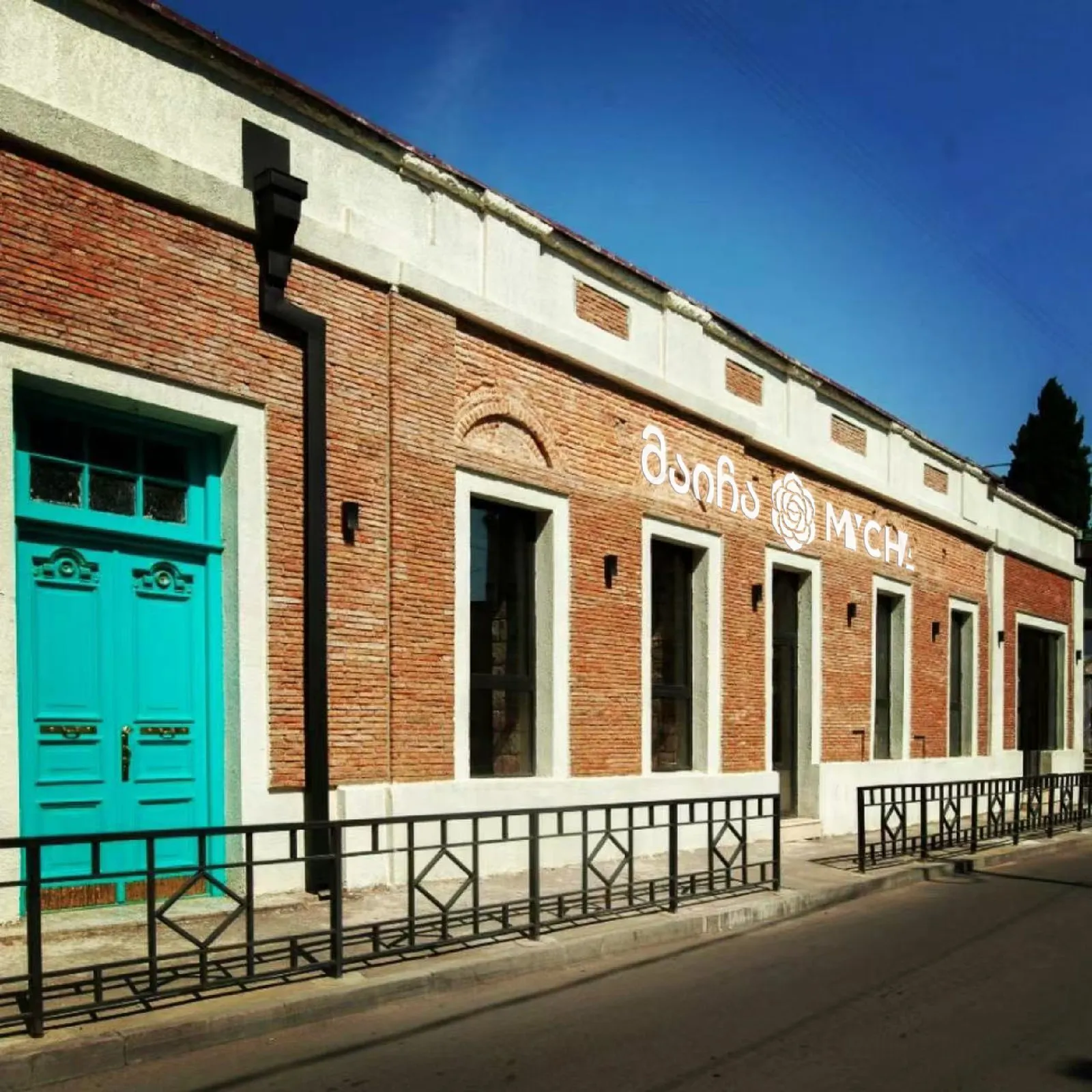The MYCHA storefront in Tbilisi, signed in both Georgian and Latin script